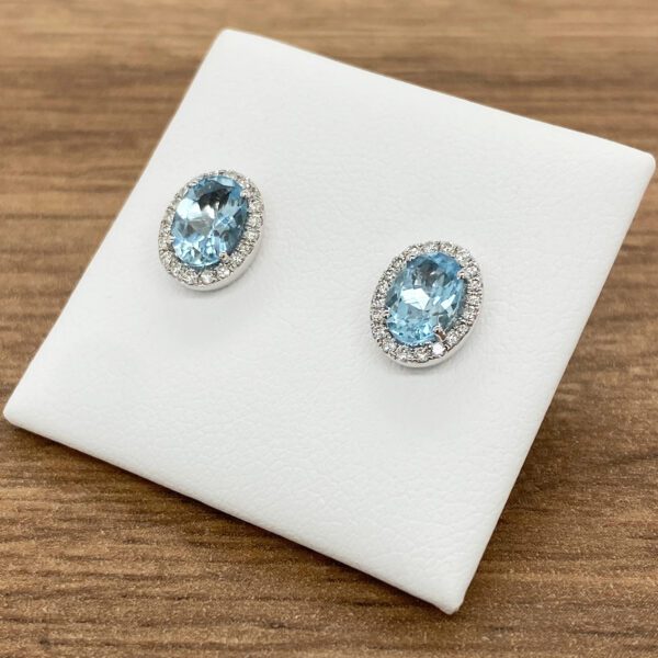 Blue topaz and diamond stud earrings.