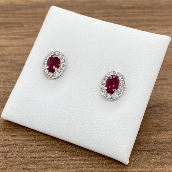 Oval ruby and diamond earrings.