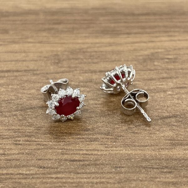 Silver ruby and diamond earrings.