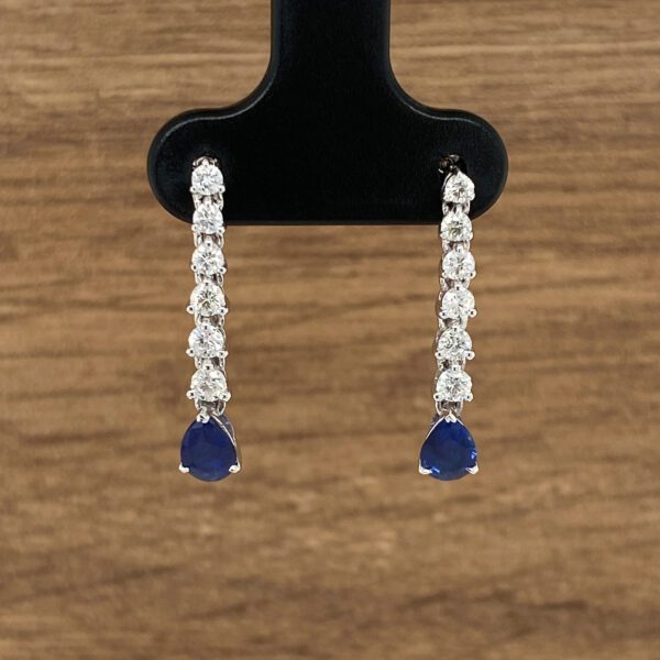 Diamond and sapphire teardrop earrings.