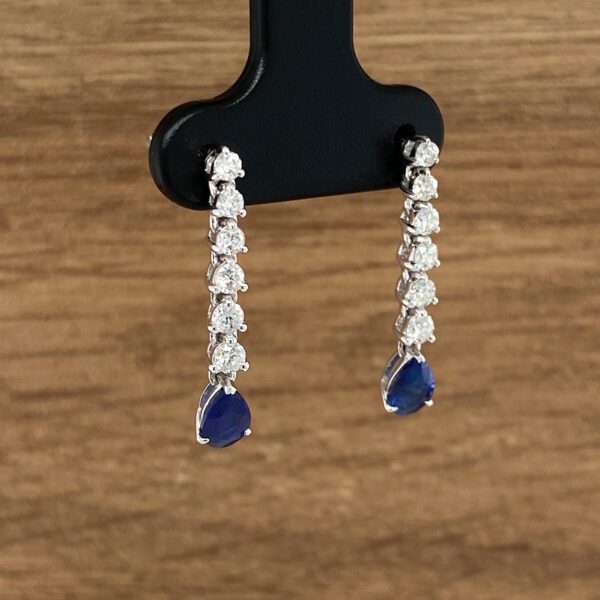 Diamond and sapphire teardrop earrings.