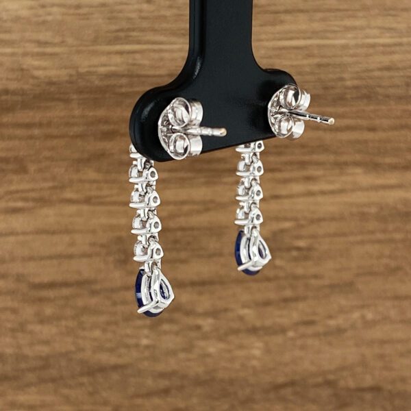 Diamond and sapphire teardrop earrings.