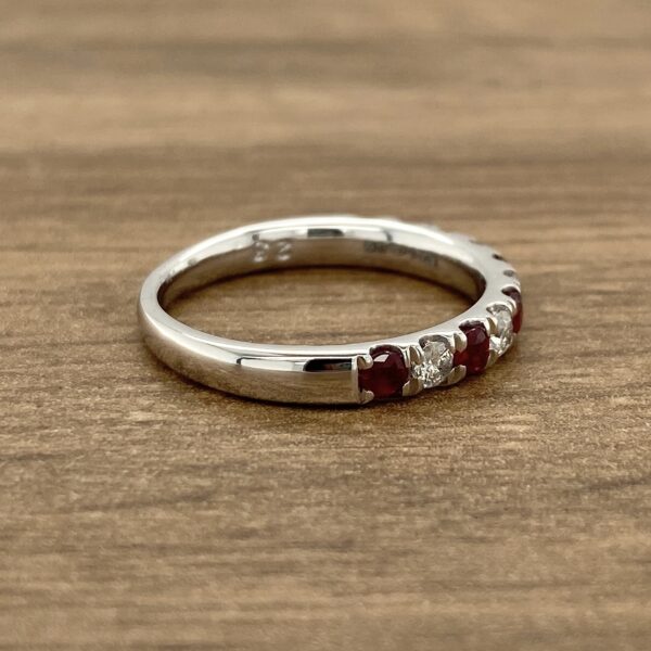 Silver band with ruby and diamond stones.