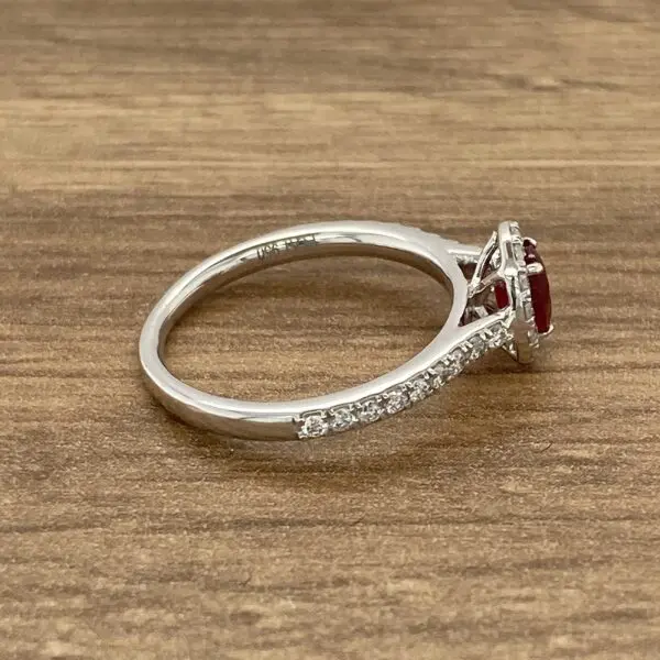 Diamond and ruby halo engagement ring.