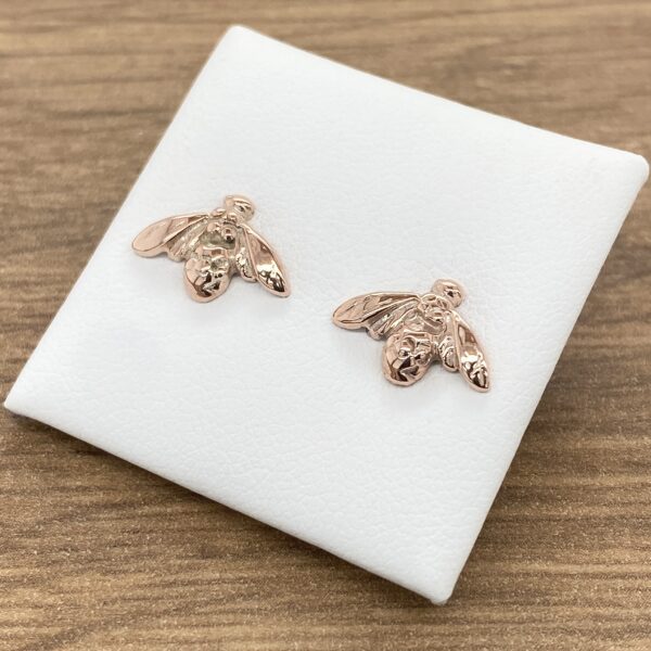 Rose gold bee stud earrings.