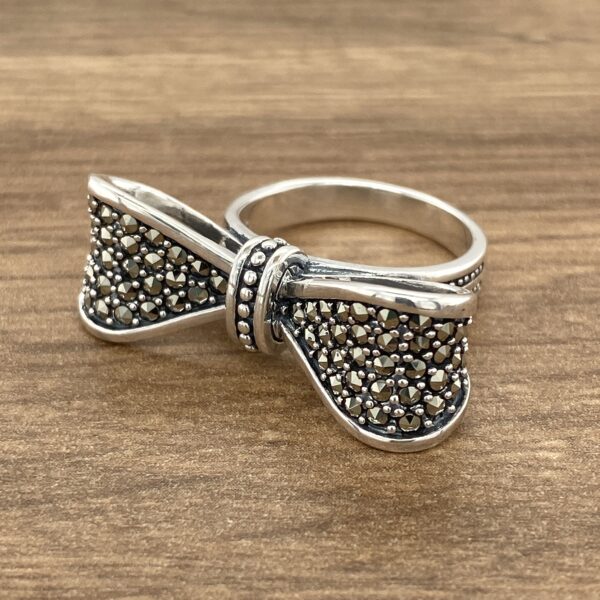 Silver bow ring with marcasite stones.