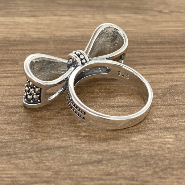 Sterling silver bow ring with marcasite stones.