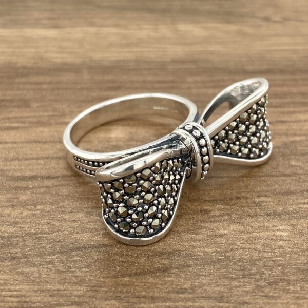 Silver ring with a marcasite bow.