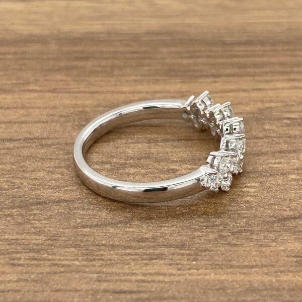 Diamond ring with a curved band.