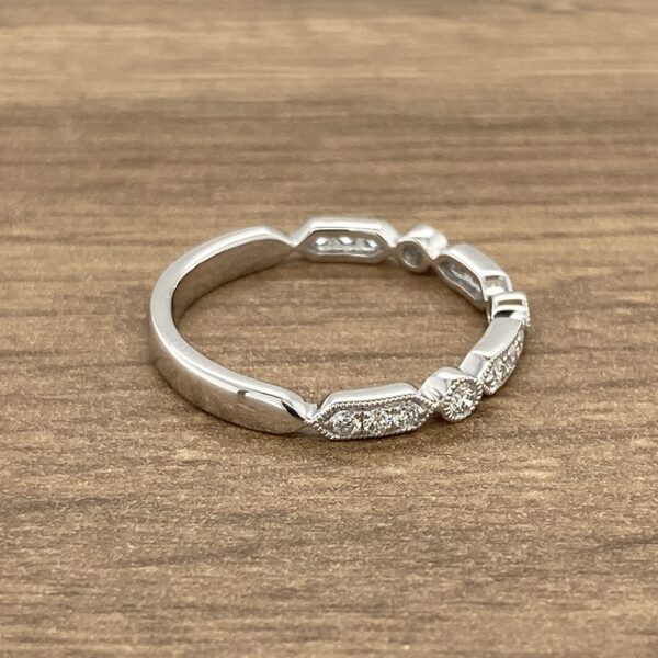 Diamond wedding band with delicate design.