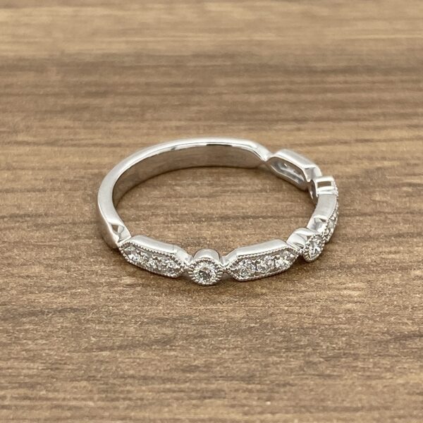 Silver band with diamond accents.