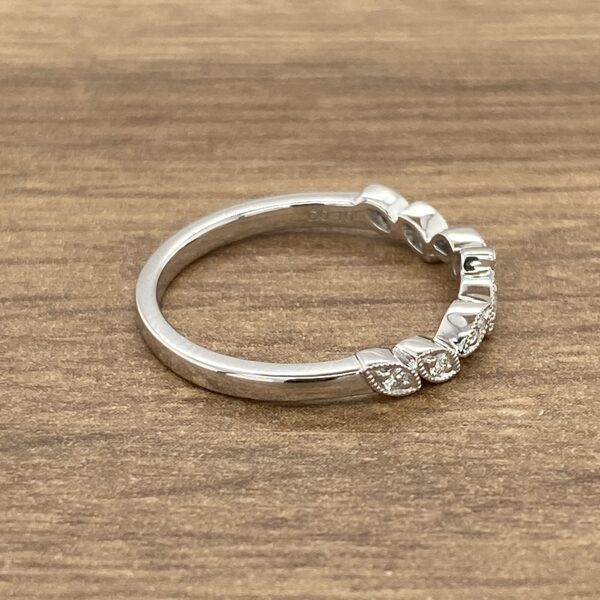 Diamond and white gold wedding band.