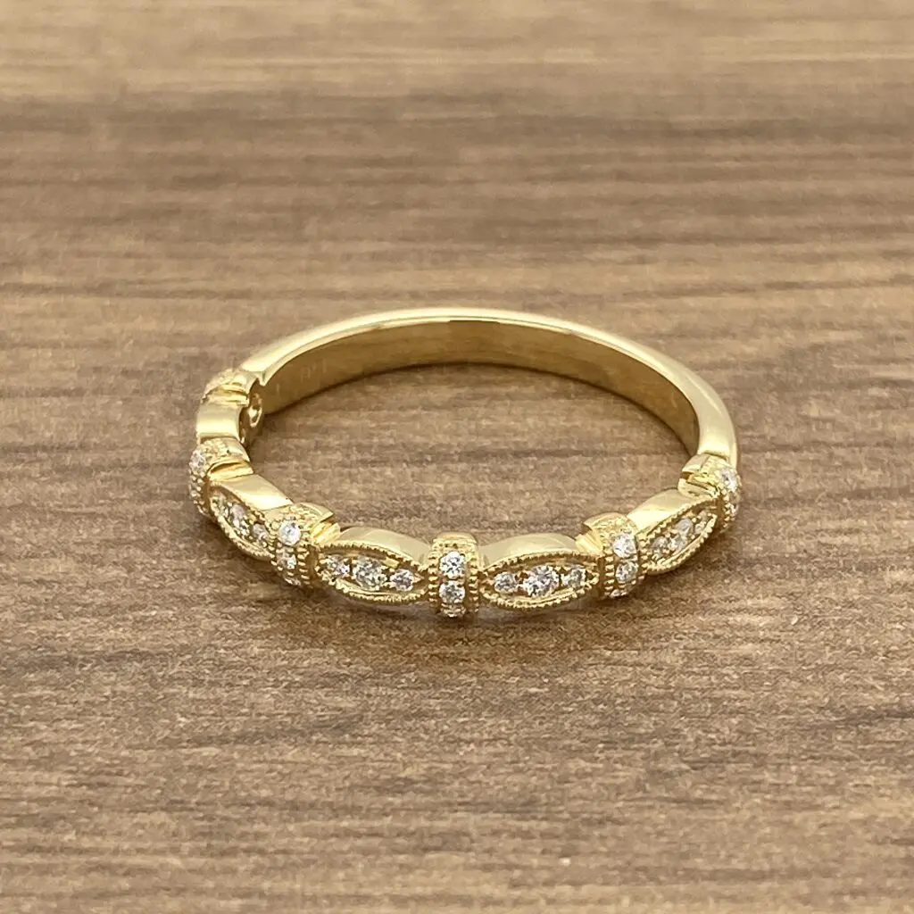 A yellow gold ring with diamonds.