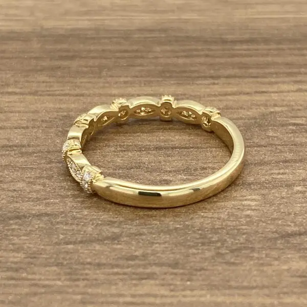 Gold band with diamond accents.