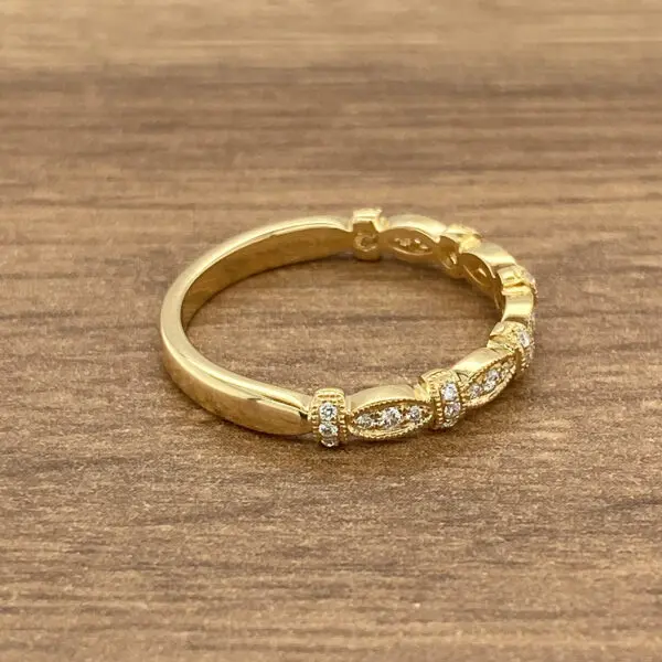 Gold band with diamond accents.