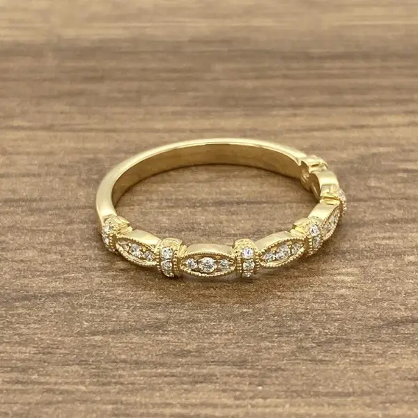 Gold band with diamond accents.