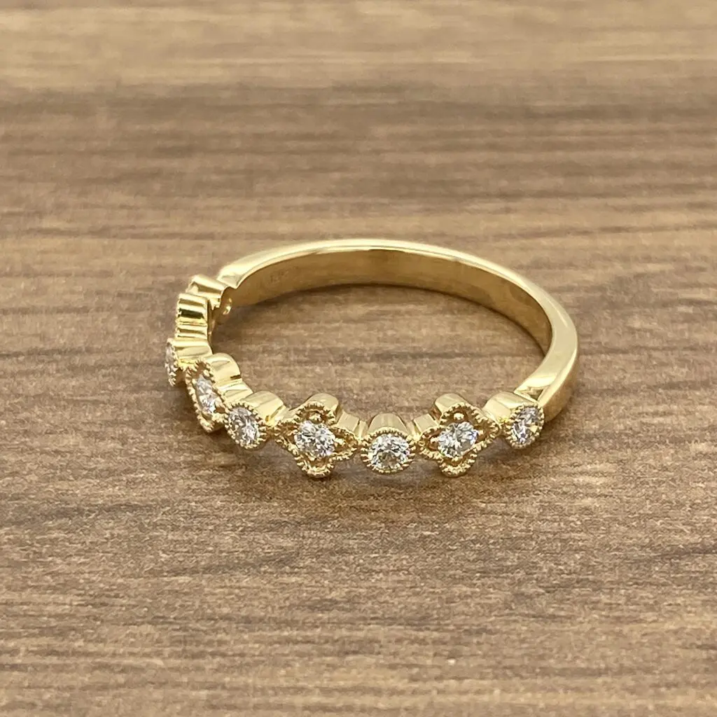 Gold ring with diamond accents.