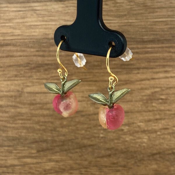 Gold peach fruit dangle earrings.