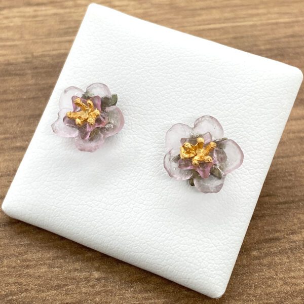 Pink flower glass earrings with gold accents.