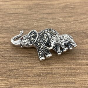 Silver elephant brooch with baby elephant.