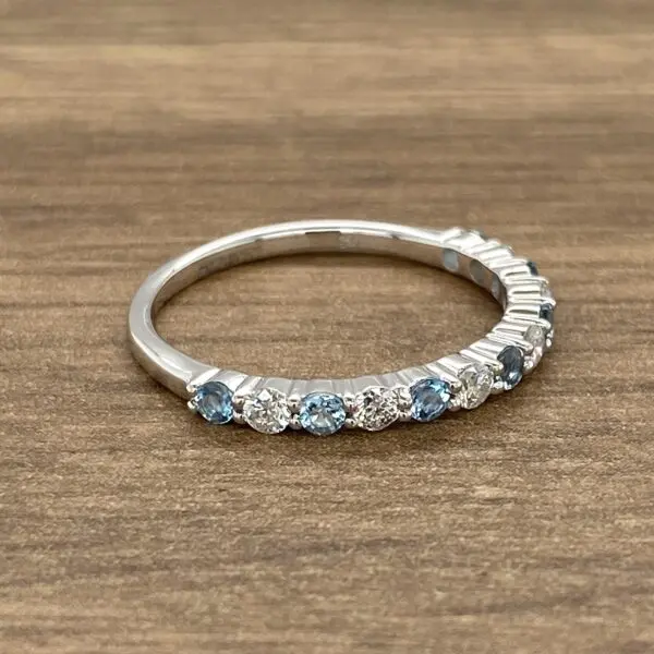 Silver band with blue and white stones.