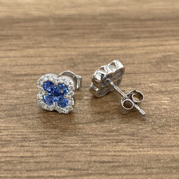 Silver earrings with blue sapphires and diamonds.