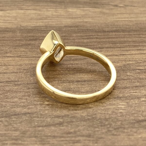 Gold ring with a single stone.