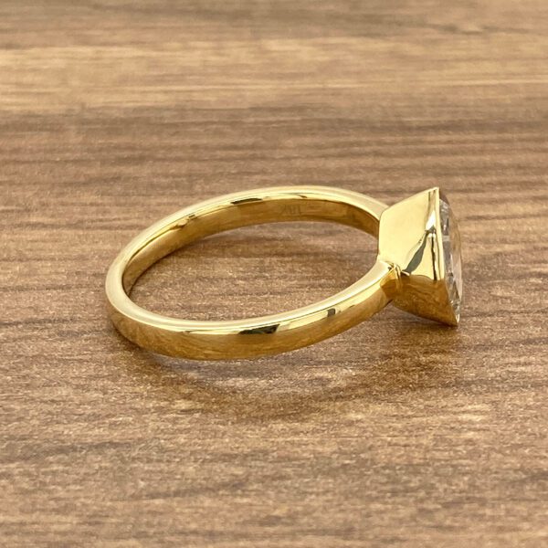 Gold ring with a large diamond.