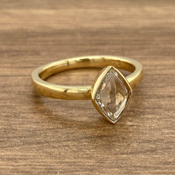 Gold ring with a large diamond.