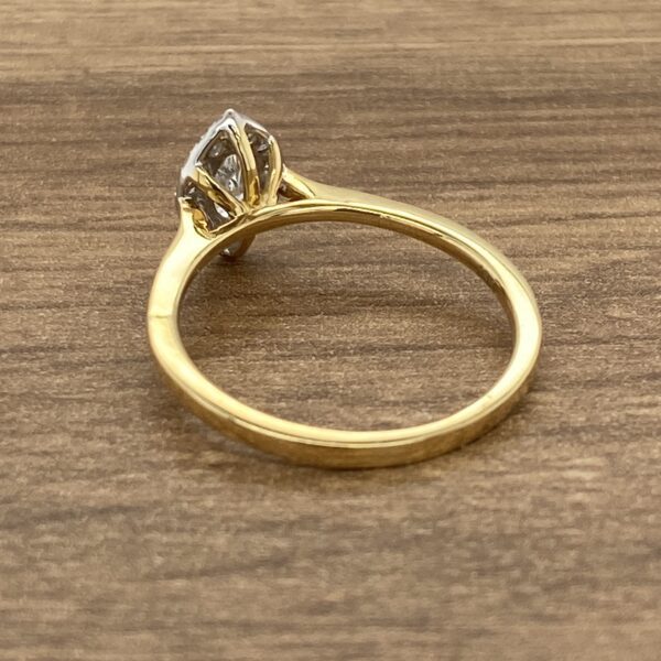 Gold ring with a diamond setting.