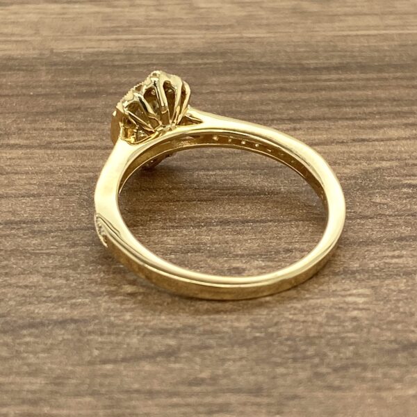 Gold ring with a diamond setting.