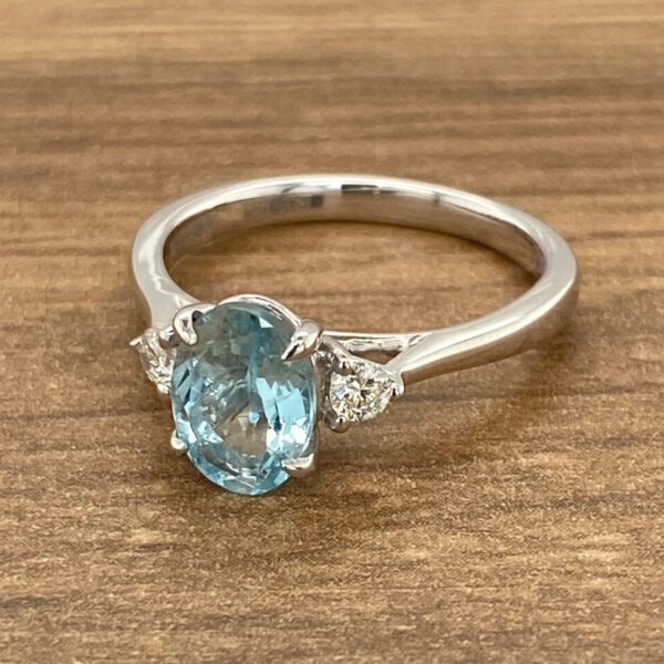 Aquamarine engagement ring with diamond accents.