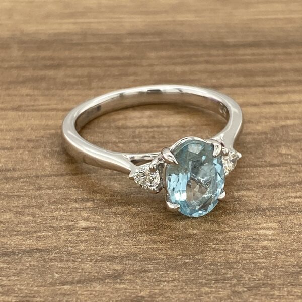 Silver ring with aquamarine and diamonds.