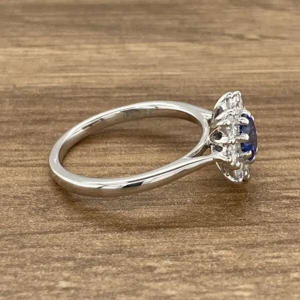 Silver ring with blue sapphire and diamonds.