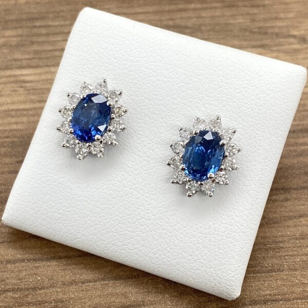 Oval sapphire and diamond earrings.