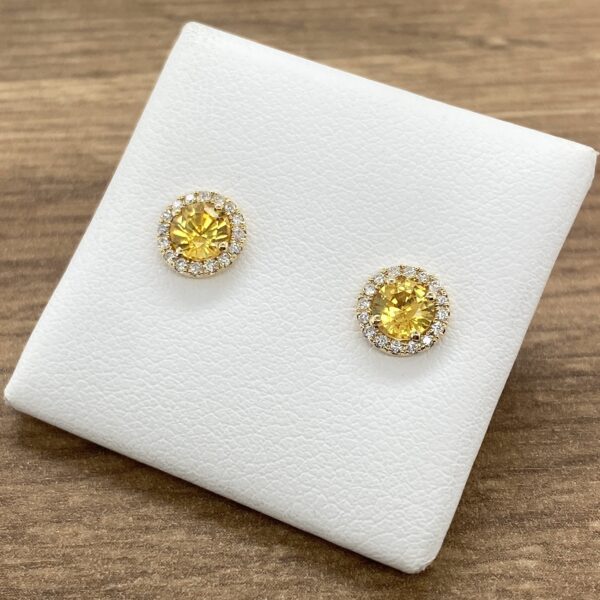 Yellow sapphire and diamond stud earrings.