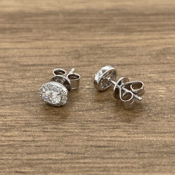 Pair of silver diamond earrings.