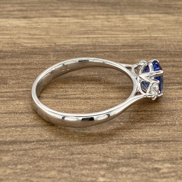 Side view of a blue sapphire ring.