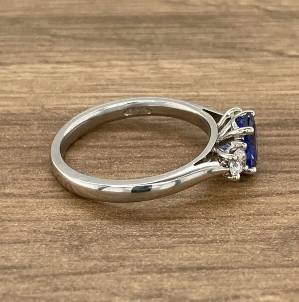 Silver ring with a blue sapphire.