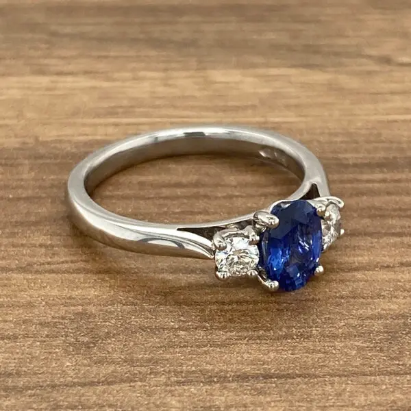 Oval sapphire and diamond engagement ring.