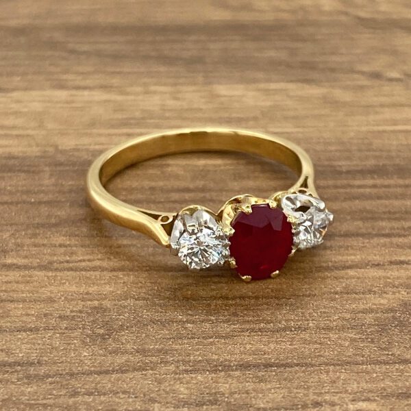 Gold ring with ruby and diamond stones.