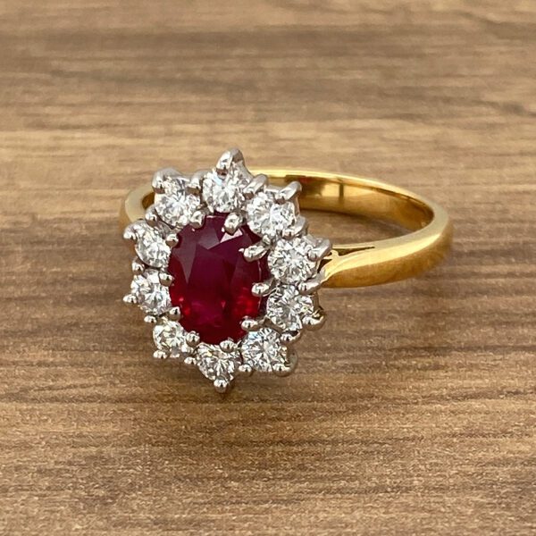 Gold ring with red ruby and diamonds.