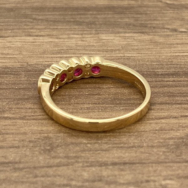 Gold ring with red ruby stones.