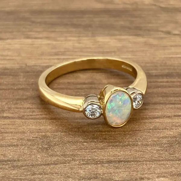 Gold ring with opal and diamonds.