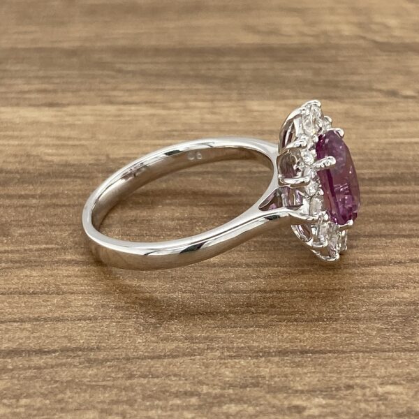 Side view of a purple gemstone ring.