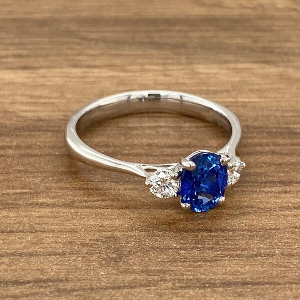 Oval sapphire and diamond engagement ring.