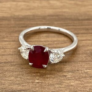 Ruby and diamond three-stone ring.