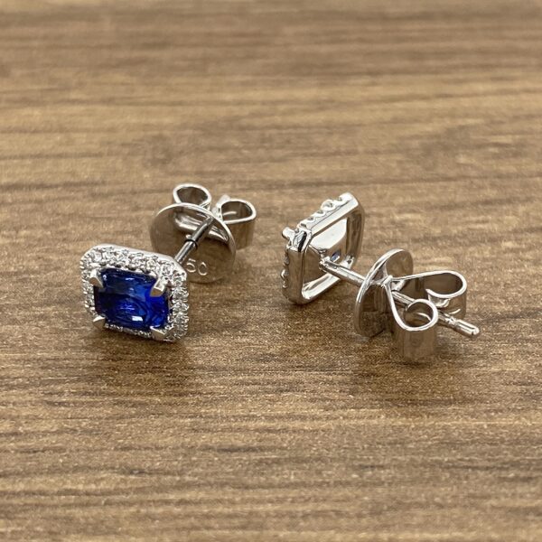 Silver earrings with blue sapphire and diamonds.