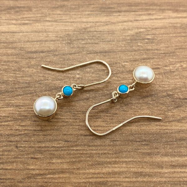 Gold pearl and turquoise earrings.