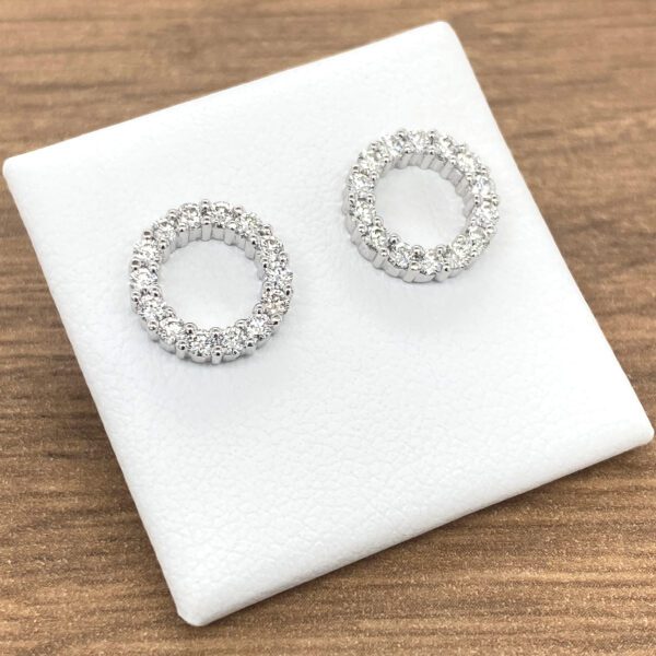 Diamond circle stud earrings on white background.